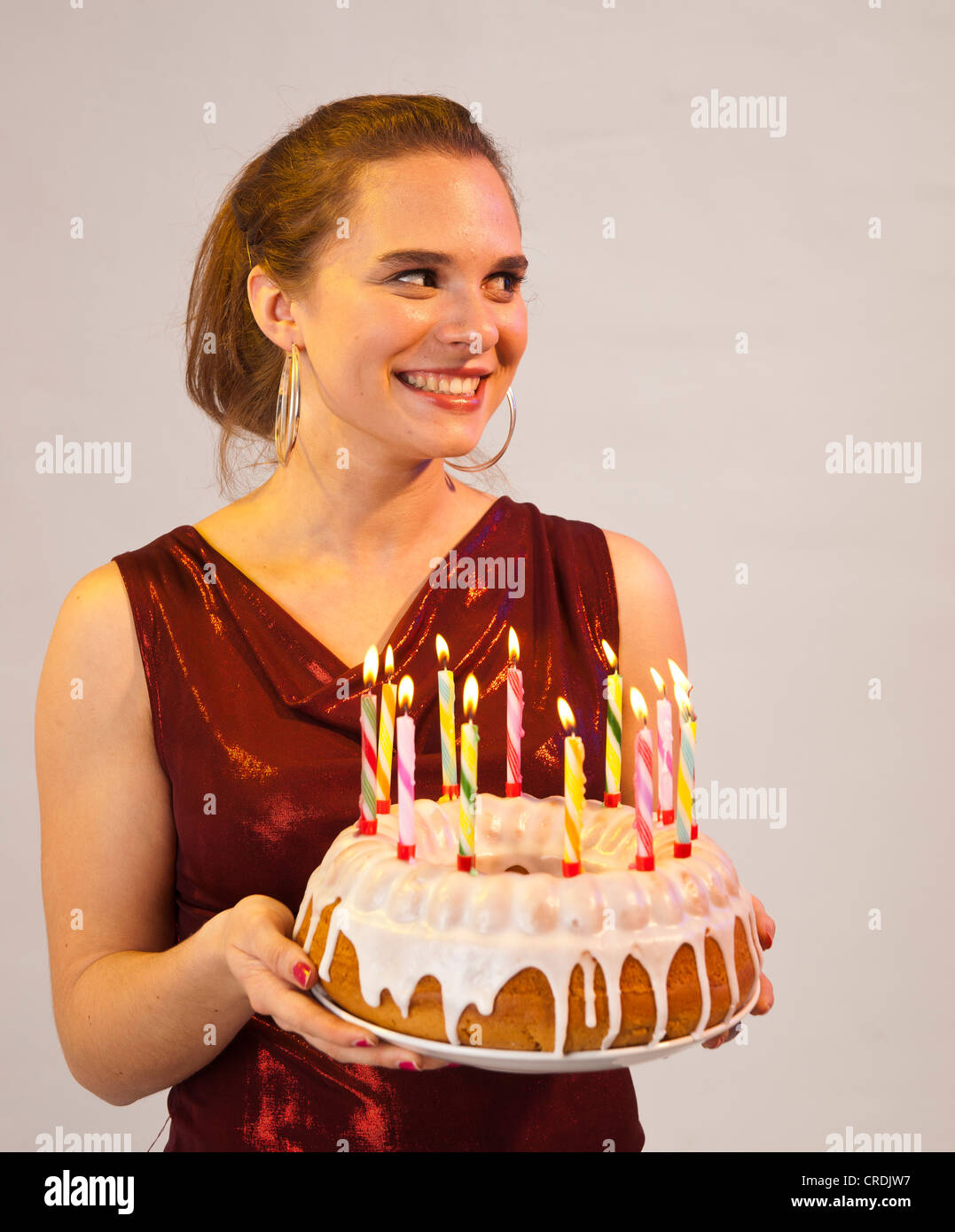 Young woman with birthday cake Stock Photo Alamy