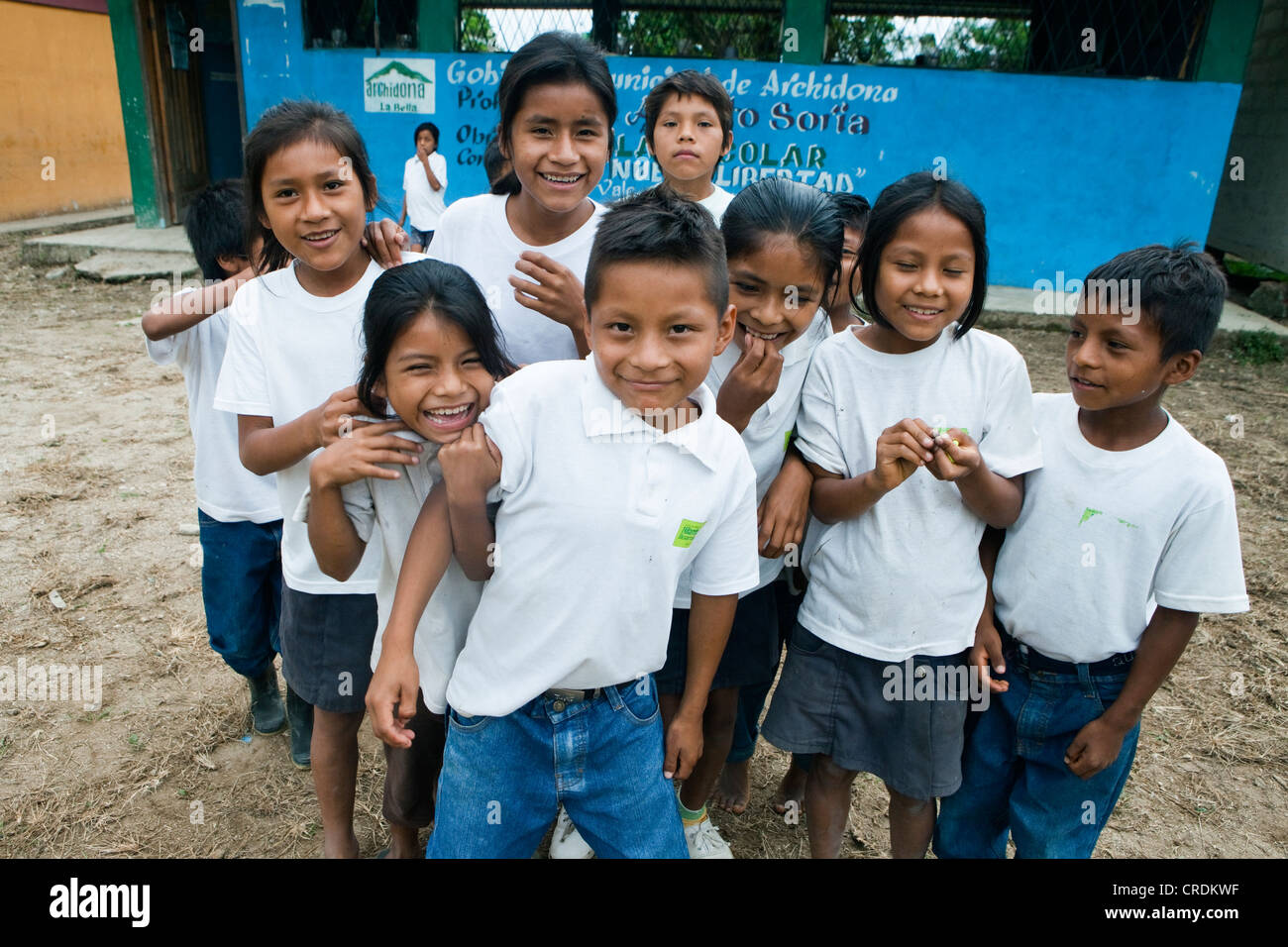 Smiling children in the playground of an elementary school in the rainforest village of Nueva Libertad, Ecuador, South America Stock Photo
