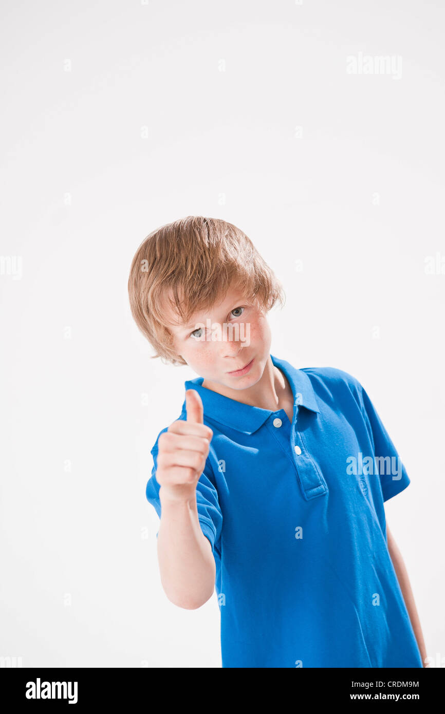 Teenage boy giving a thumbs up Stock Photo - Alamy