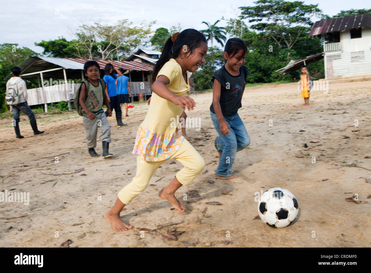 School children playing football in the schoolyard before the start of