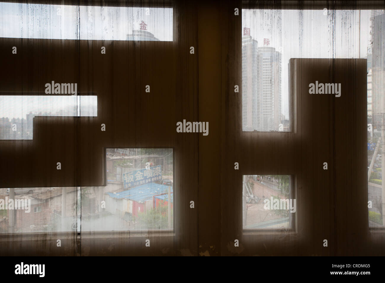Looking out of a window in a bar, in Beijing, China. Stock Photo