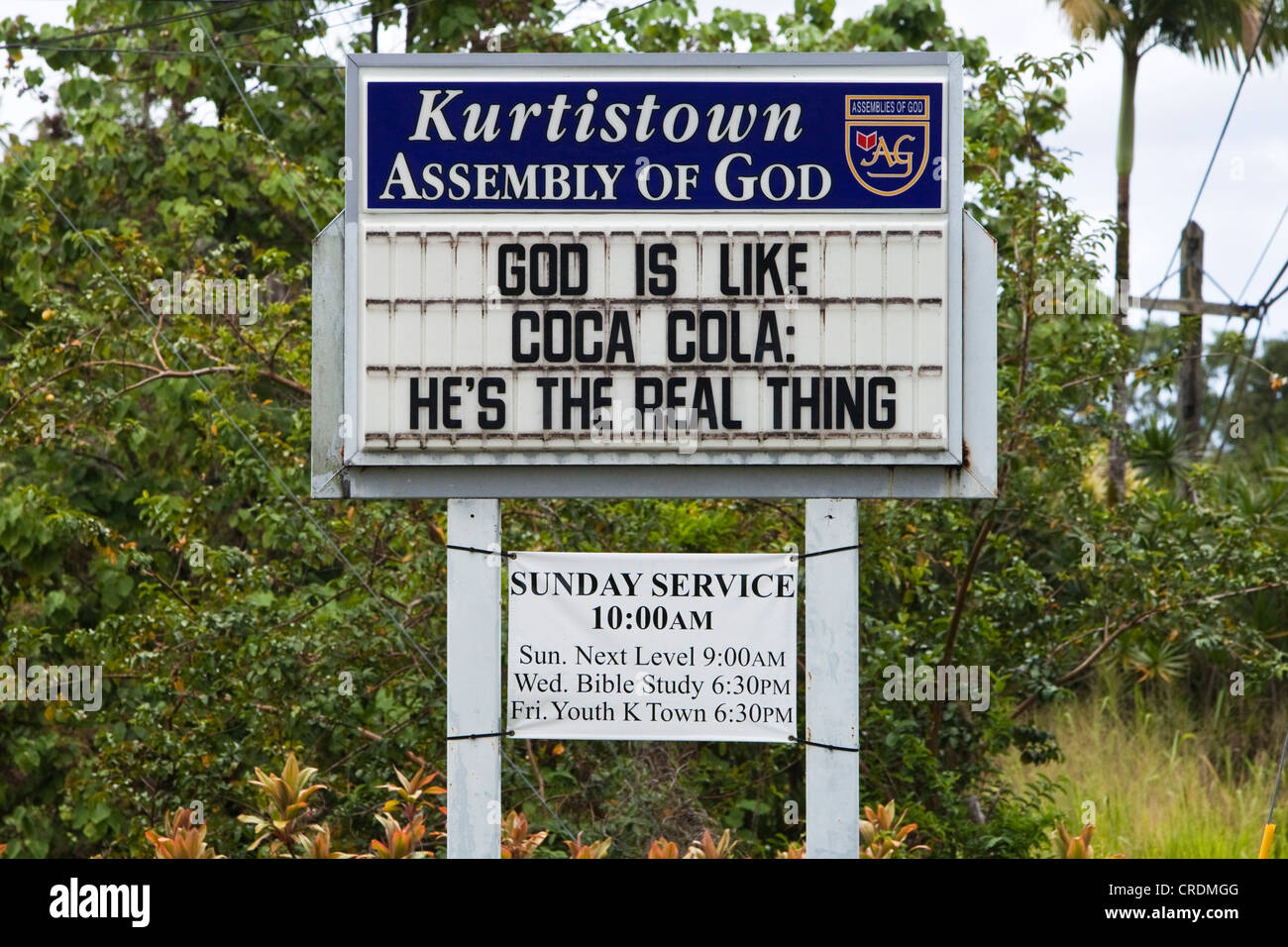 A church sigh saying 'God is like Coca Cola, He's the real thing', Kurtistown, Hawaii, USA Stock Photo