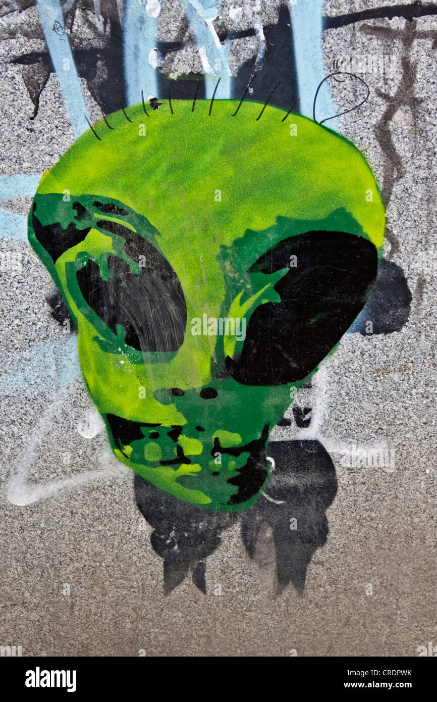 Alien, stencil graffiti on the wall of a building, Riga, Latvia, Europe Stock Photo