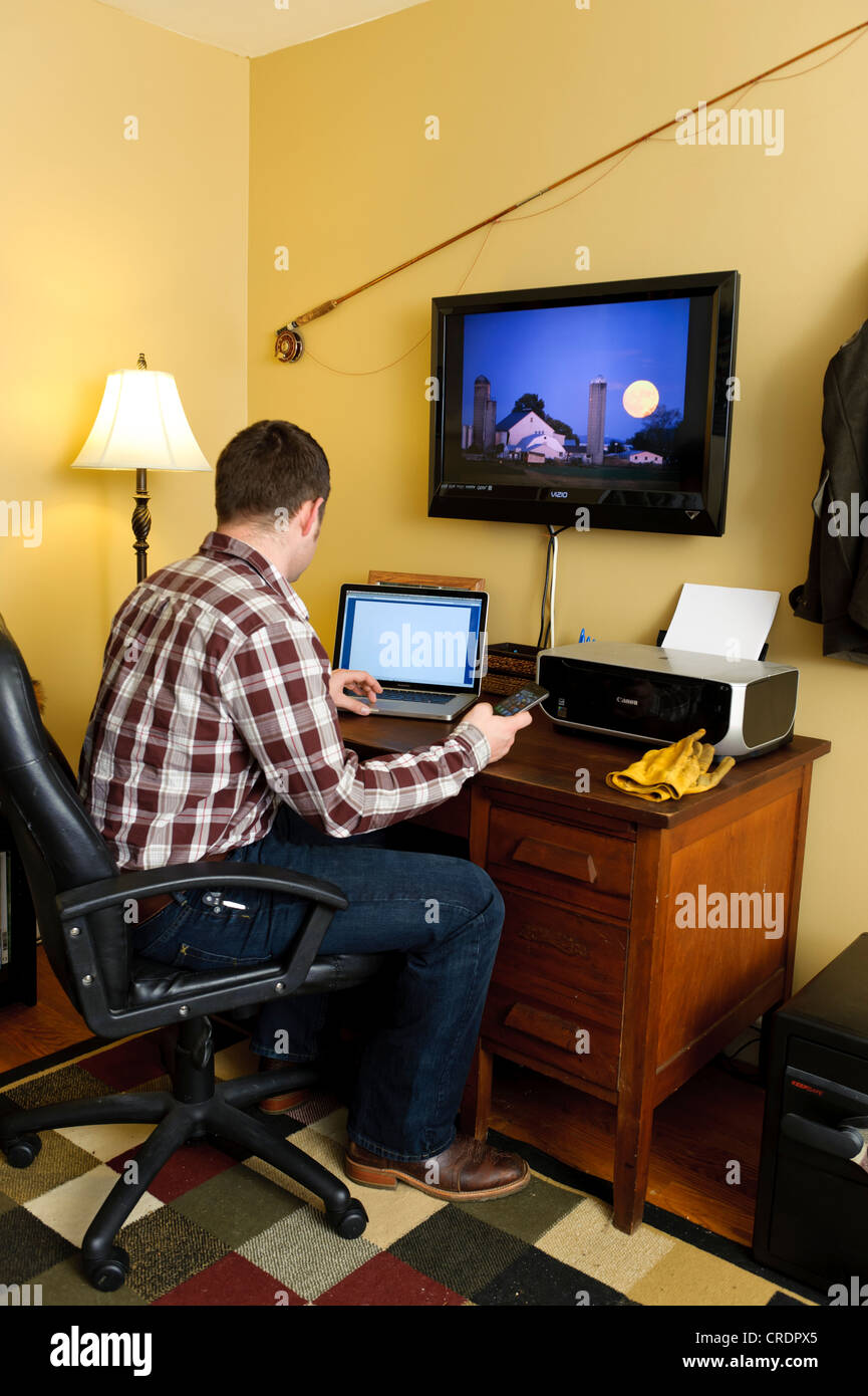 FARMER IN HOME OFFICE USING LAPTOP COMPUTER; WORKING FROM HOME Stock ...