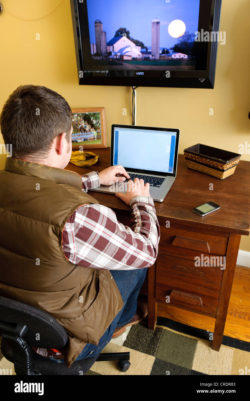 FARMER IN HOME OFFICE USING LAPTOP COMPUTER; WORKING FROM HOME Stock ...