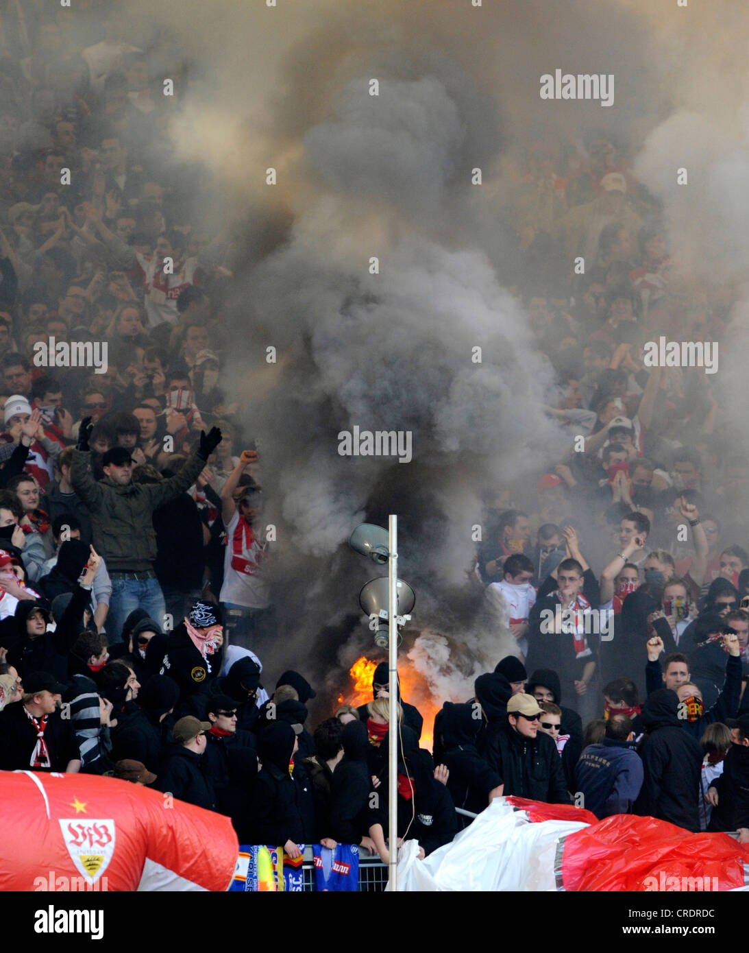 football, hooligans setting fire at stand Stock Photo