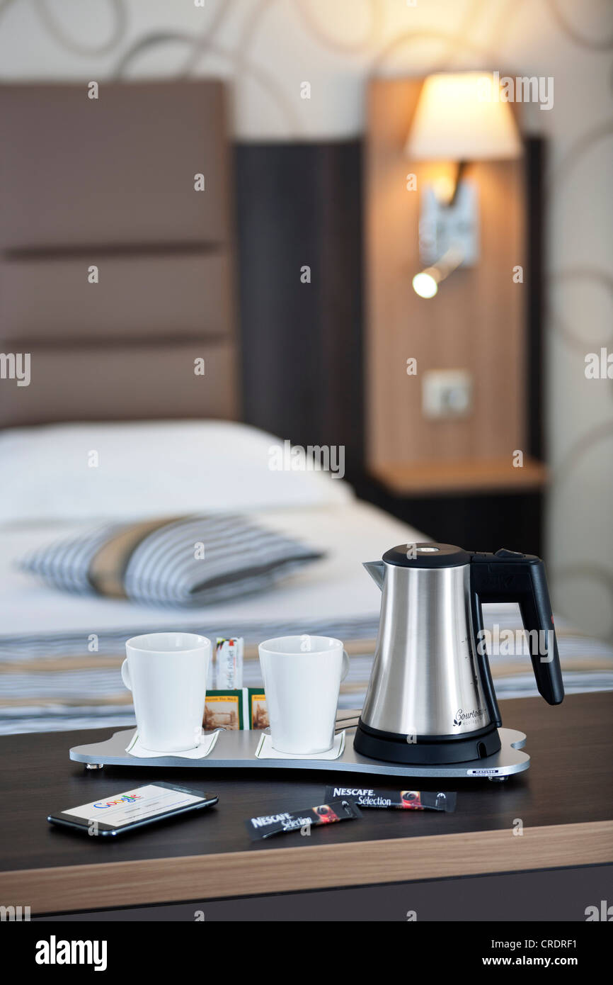 A courtesy tray in a hotel room (France).  Tea and coffee making facilities in a hotel room. Hospitality tray. Stock Photo