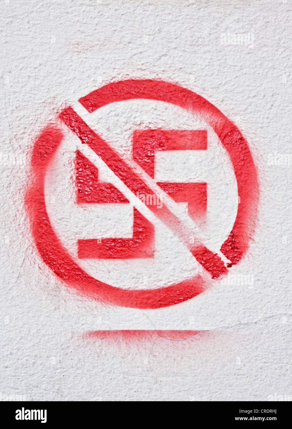Red swastika struck through, symbol against Nazis, against National Socialism, stencil, art on facade Stock Photo