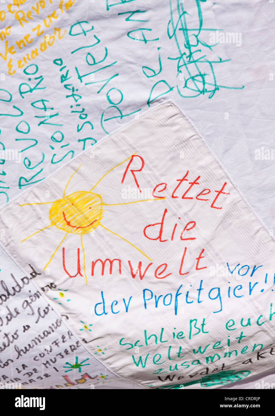 Rettet die Umwelt or Save the Environment, written on and painted on sheet, environmental conservation Stock Photo