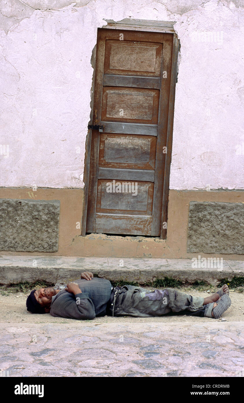Drunk sleeping on the street in Ayacucho, Peru. Stock Photo