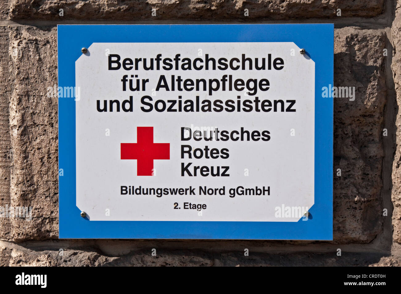 Sign on a building, Berufsfachschule fuer Altenpflege und Sozialassistenz, Deutsches Rotes Kreuz, German for Vocational School Stock Photo