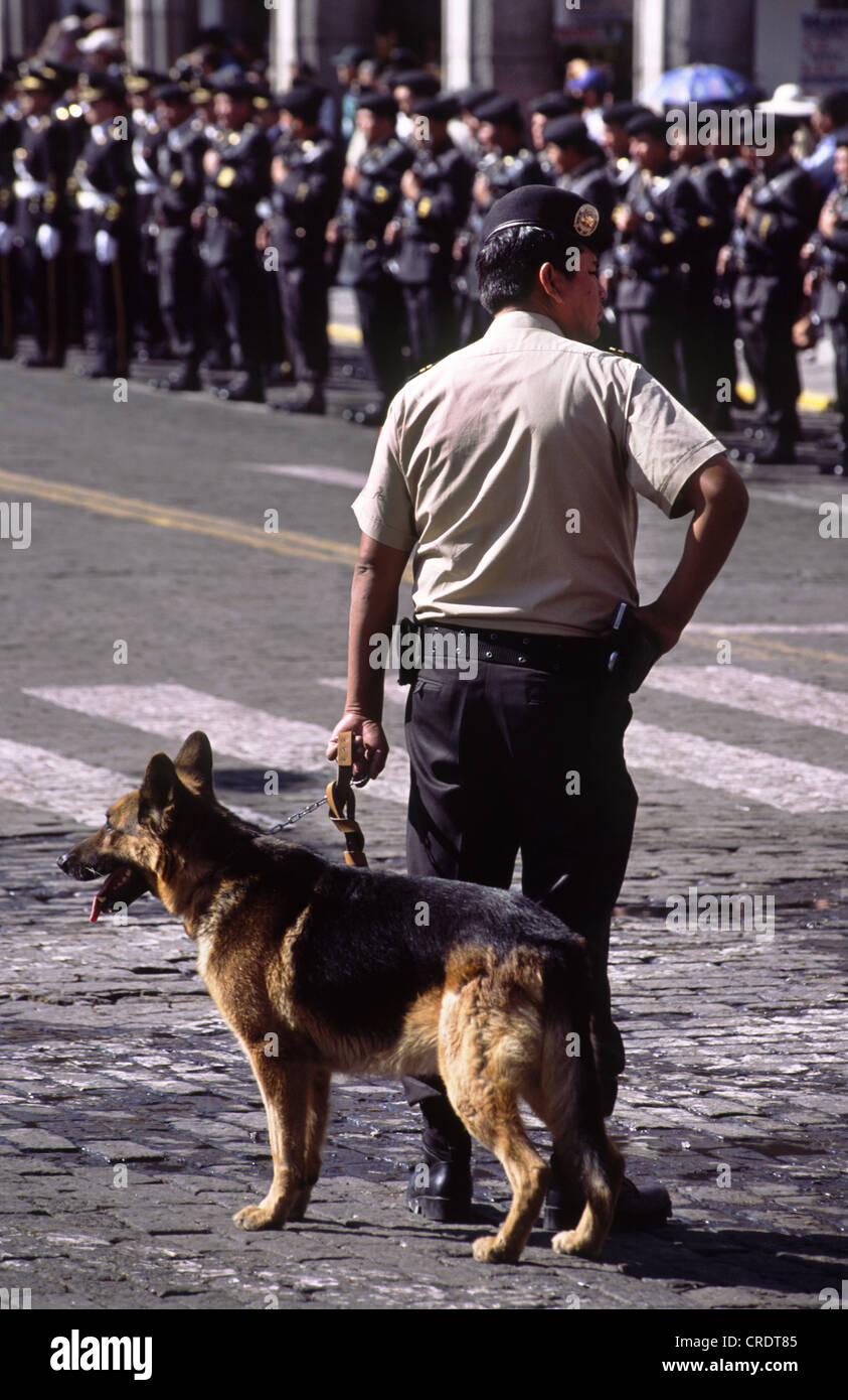 Police with dog during Arequipa Day parade. Peru. Stock Photo