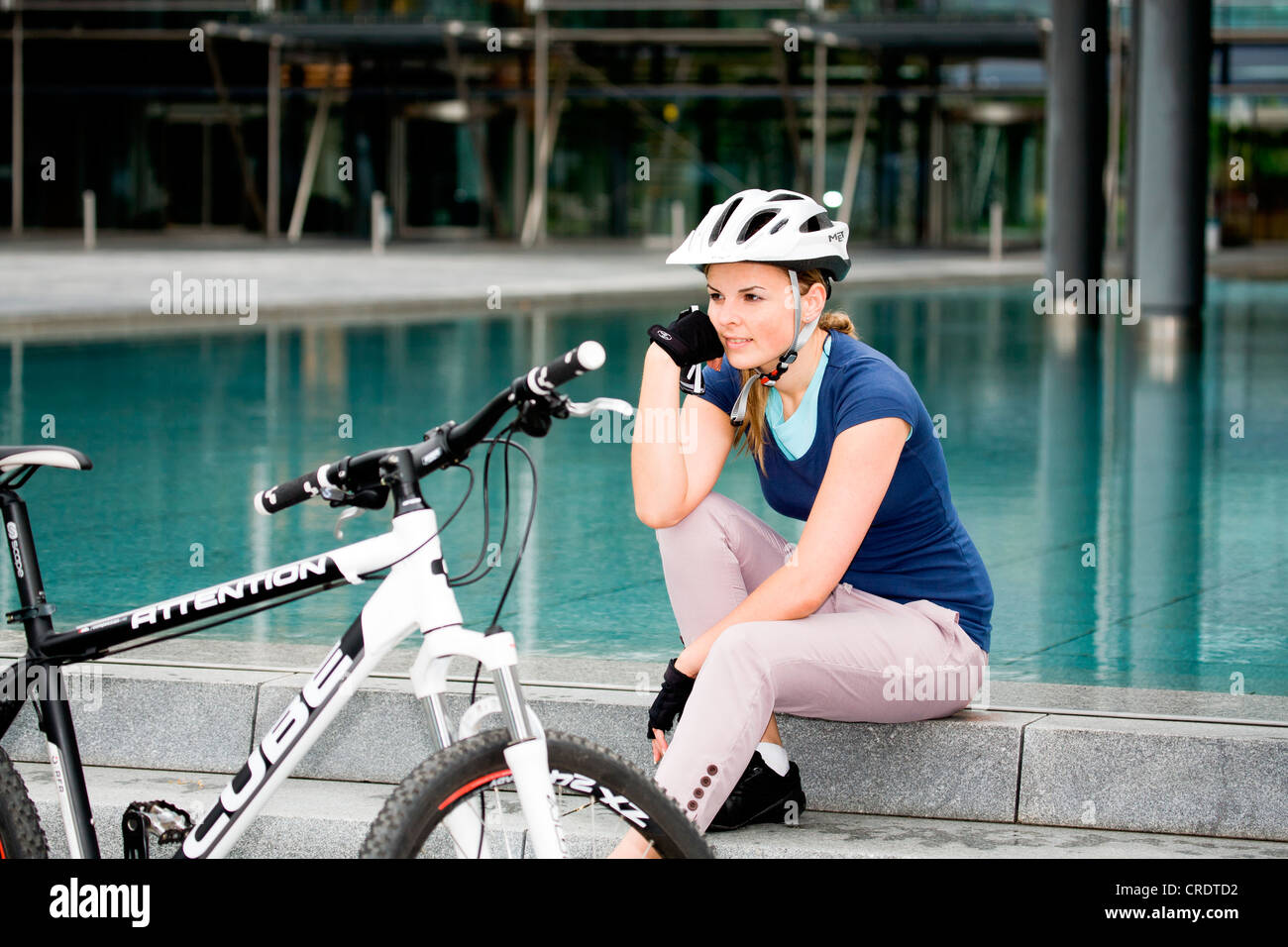 Female cyclist in an urban surrounding Stock Photo Alamy