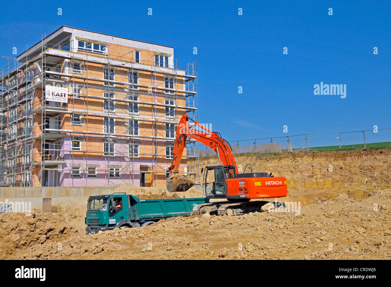 A building pit is being excavated, earth works, construction of an apartment building in Ulm, Baden-Wuerttemberg, PublicGround Stock Photo
