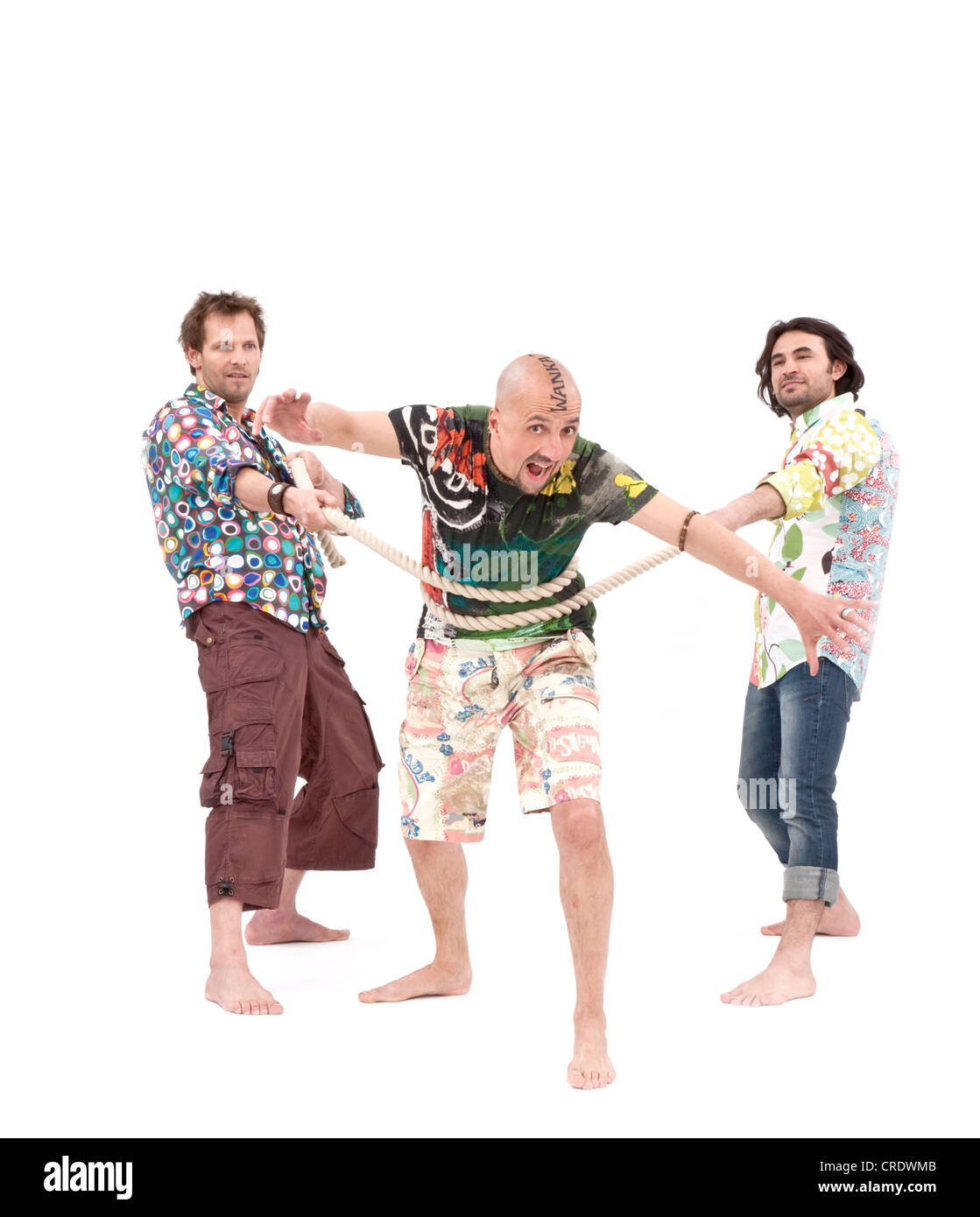 Three friends, two holding the third with a rope Stock Photo - Alamy