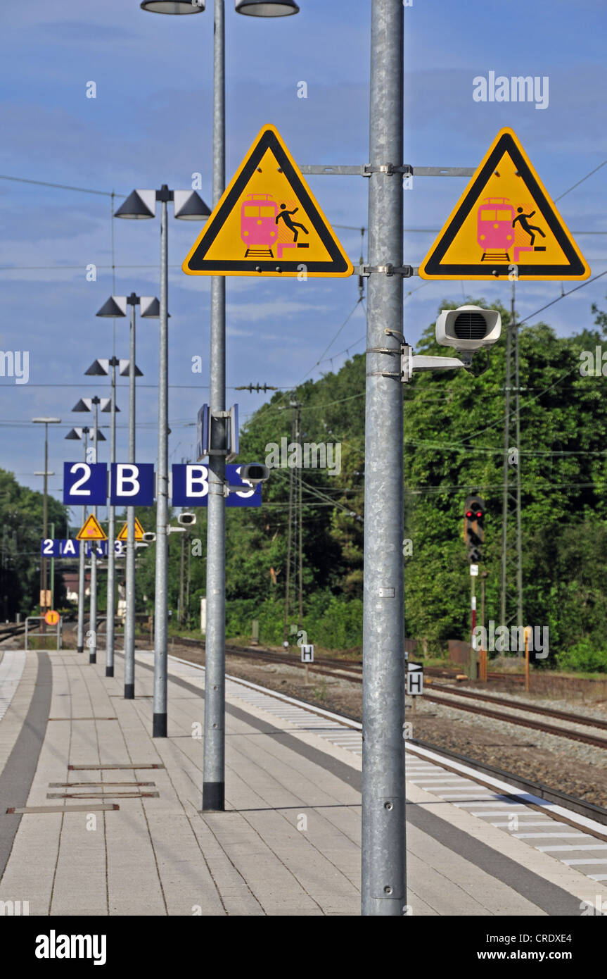 Platform with warning signs, warning of undertow and falling on the ...