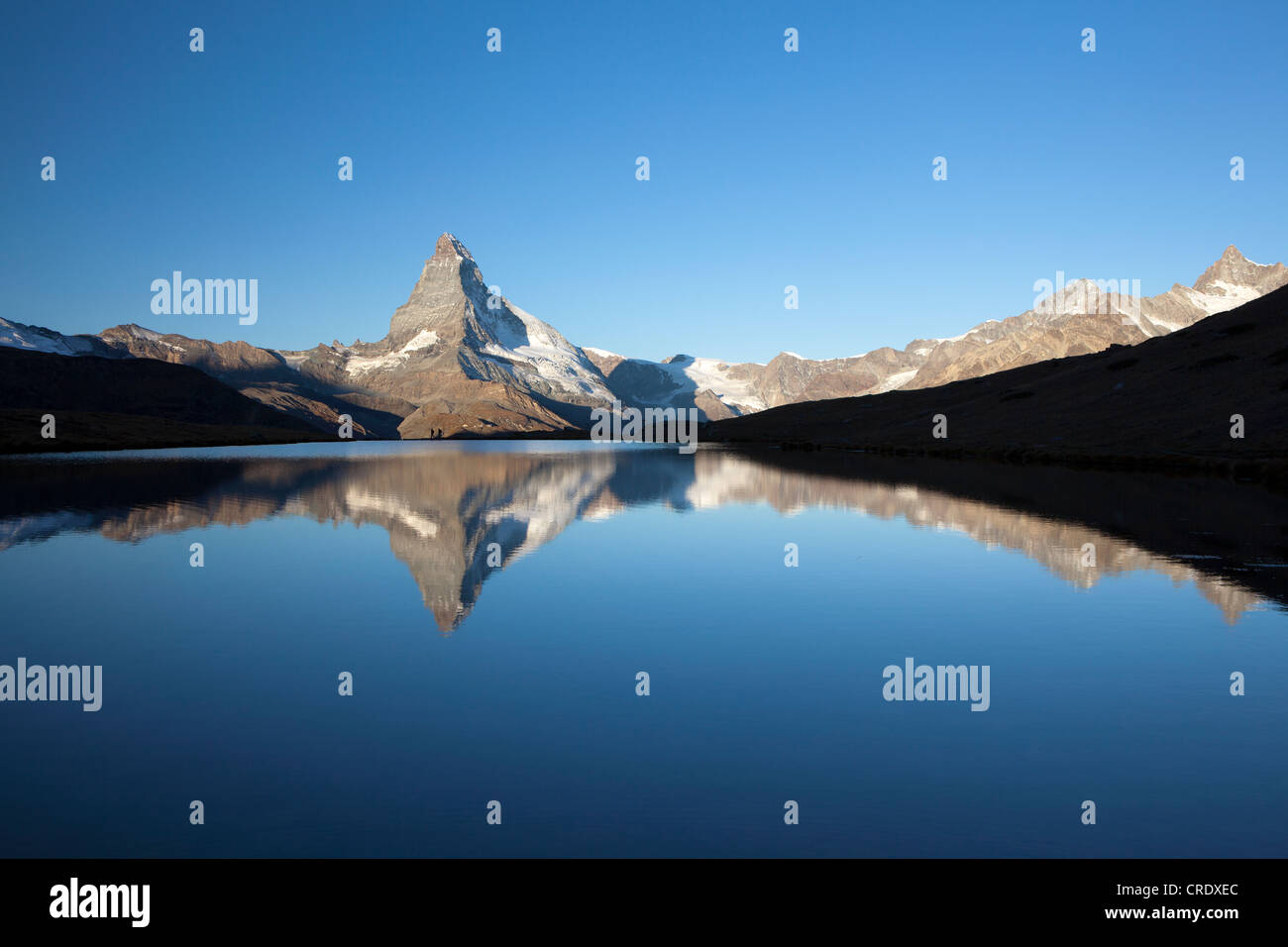 Morning mood with the Matterhorn reflected in Lake Stellisee, Zermatt ...