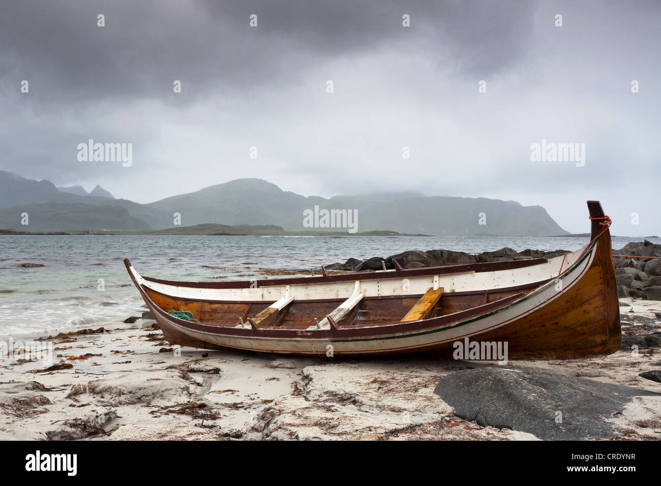 Boat on the sandy beach in the rain, Lofoten Islands, Norway, Scandinavia, Europe, PublicGround Stock Photo