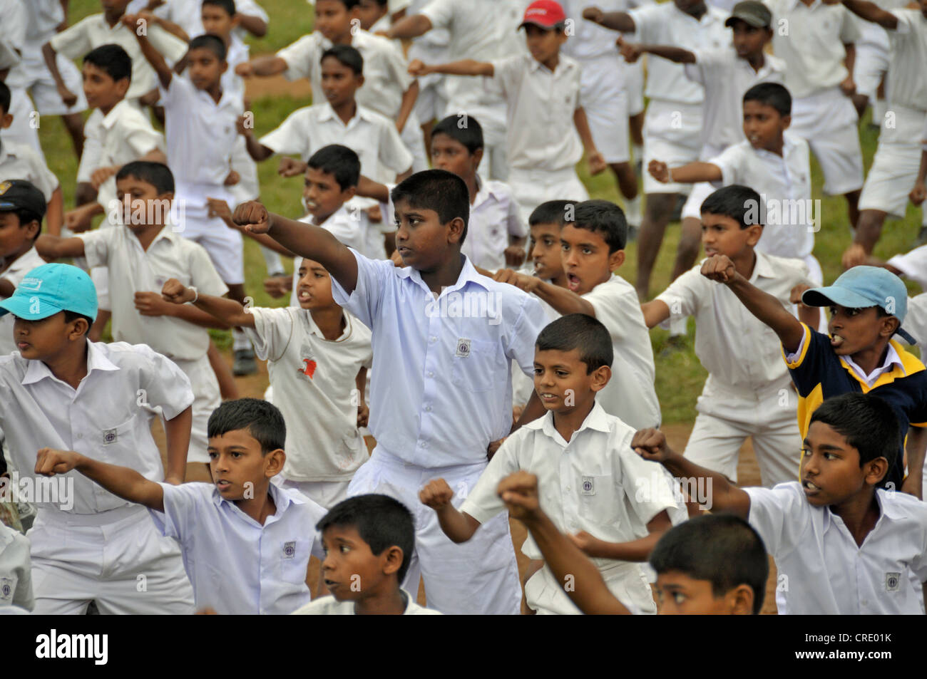 Karate exercises, boys wearing white school uniforms, Galle, Sri Lanka