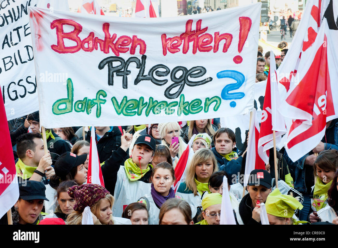 Banner 'Banken retten! Pflege darf verrecken', German for 'Saving the banks. Letting care go to pieces', rally with 1500 Stock Photo