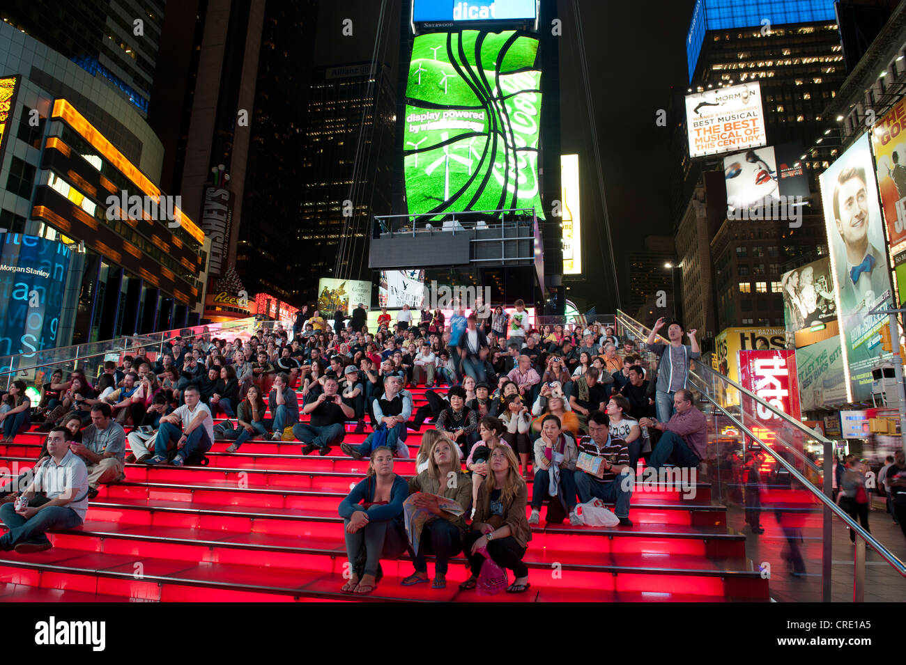 Many people on red stairs, TKTS, Broadway, Times Square pedestrian zone, Midtown, Manhattan, New