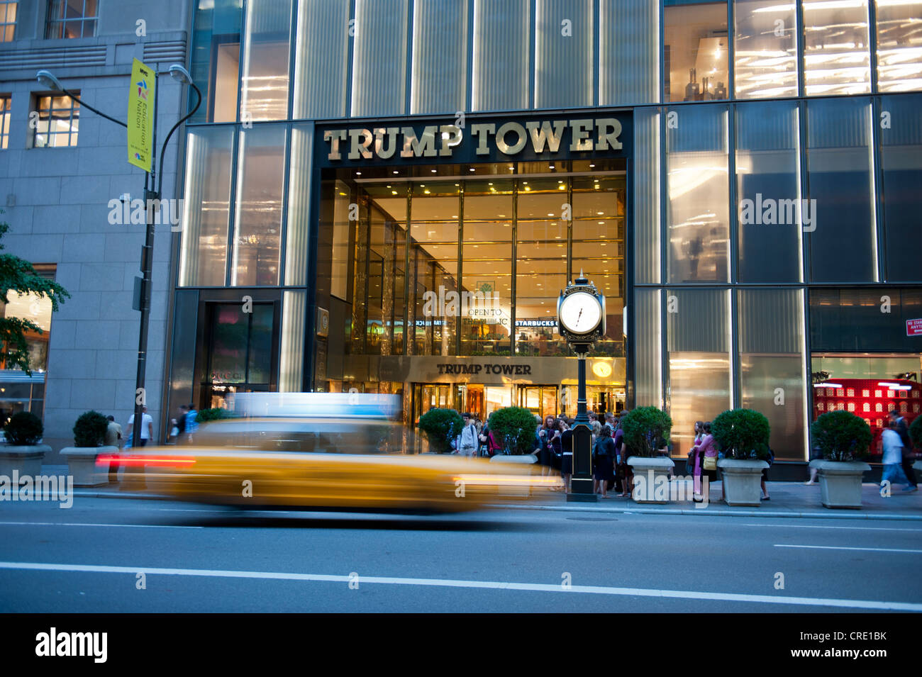 Traffic at dusk, yellow cab, taxi, motion blur, in front of the entrance to Trump Tower, 5th Avenue, Midtown, Manhattan Stock Photo