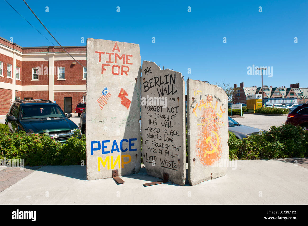 Three panels of the Berlin Wall, graffiti The Berlin Wall, on display