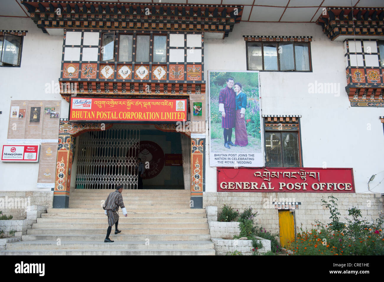 Post office, entrance to the main post office, picture of the royal couple on a wall, capital of Thimphu, the Himalayas Stock Photo