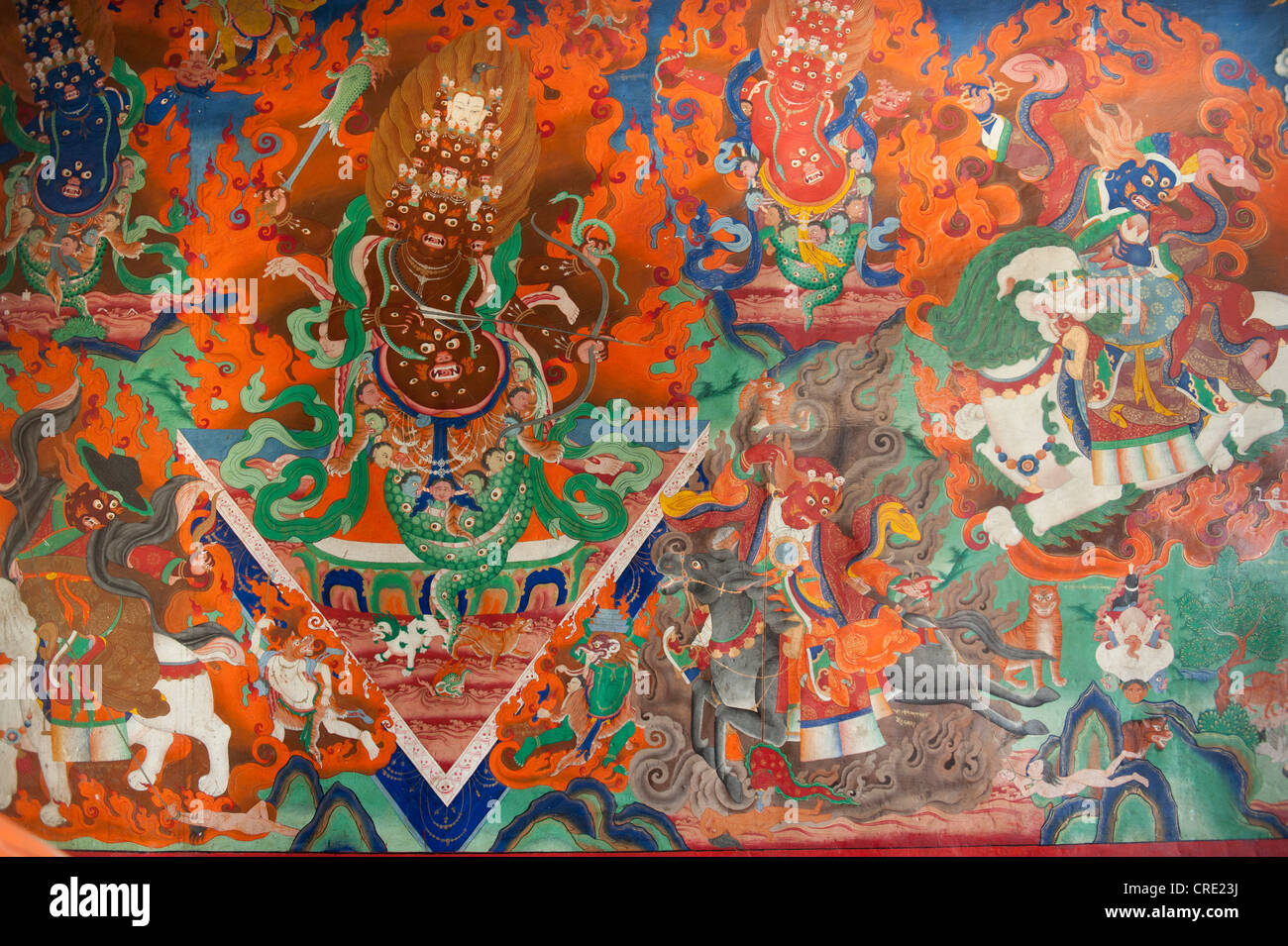 Tibetan Buddhism, old wall painting in the assembly hall, demon fighting with bows and arrows, Trakthok Gompa Monastery Stock Photo