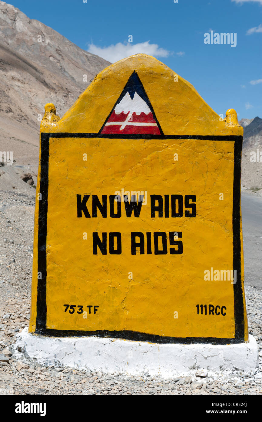 Sign, 'know AIDS, no AIDS', marking on the mountain pass road, Manali-Leh highway, near Sarchu, Lahaul and Spiti district Stock Photo