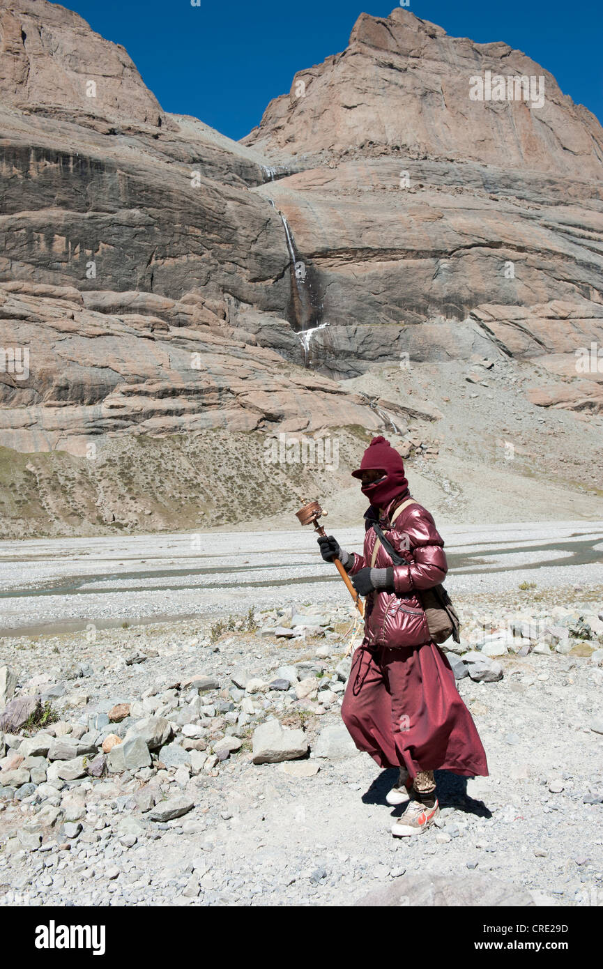 Tibetan Buddhism, monk of the Bon religion on the pilgrimage route counter clockwise around the sacred Mount Kailash Stock Photo