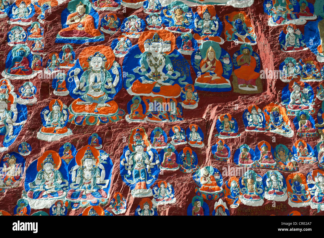 Tibetan Buddhism, colorful rock paintings, plenty of images of Buddha ...