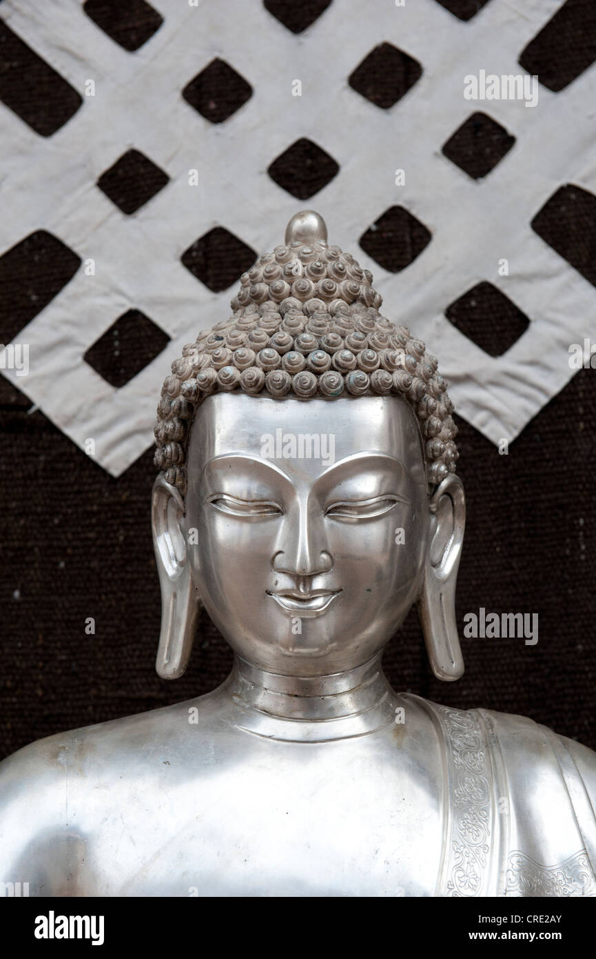 Tibetan Buddhism, silver Buddha statue, symbol of the endless knot or eternal knot, Jokhang Temple, Lhasa, Himalayas, Tibet Stock Photo
