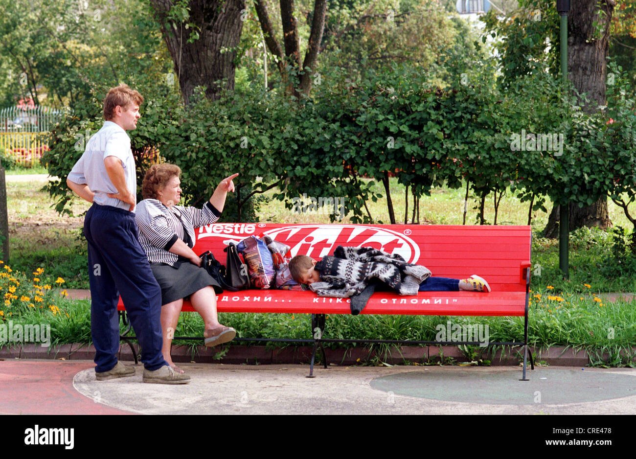 Boy sleeping on park bench hi-res stock photography and images - Alamy