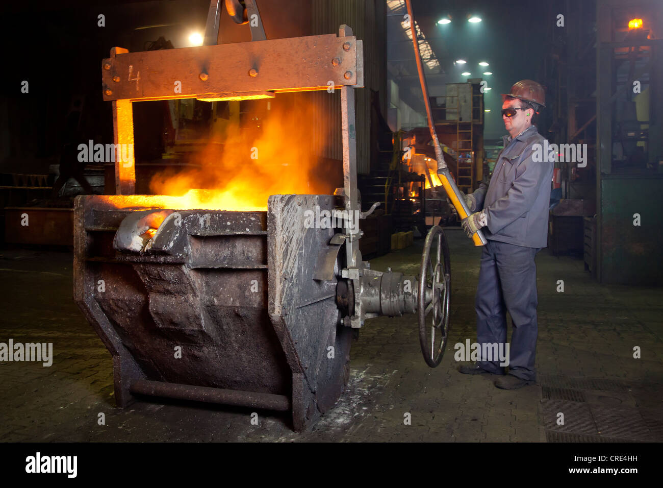 An employee of the Luitpoldhuette AG, a foundry that specializes in the casting of engine blocks, motor parts and refrigeration Stock Photo