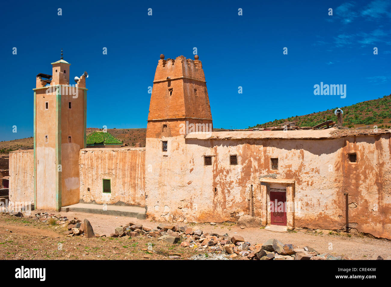 Islamic mosque with a minaret and part of a Kasbah, mud fortress, residential Berber castle, Tighremt, village of Ait Ourhaine Stock Photo