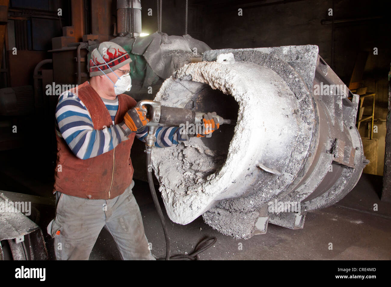 An employee of Luitpoldhuette AG, a foundry that specializes in the casting of engine blocks, motor parts and refrigeration Stock Photo
