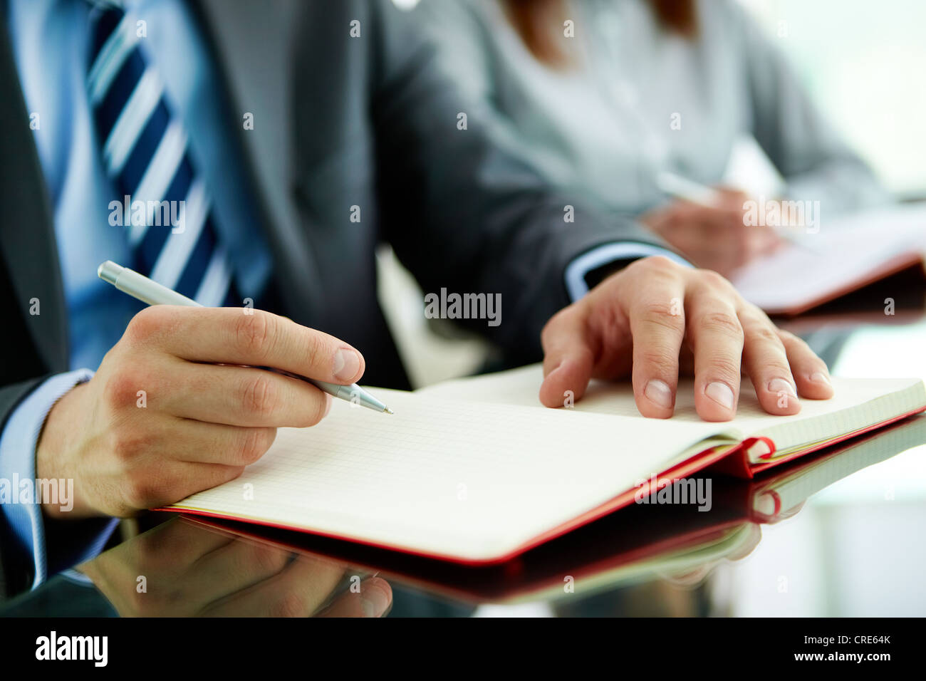 Close-up of a business worker with a blank notebook Stock Photo