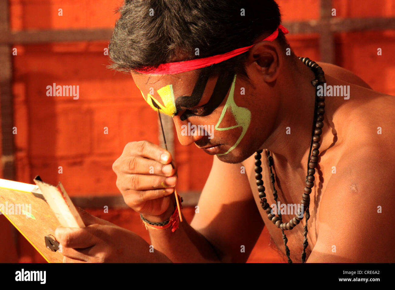 Kathakali dancer man closeup prepares to dance in Kerala, India Stock Photo