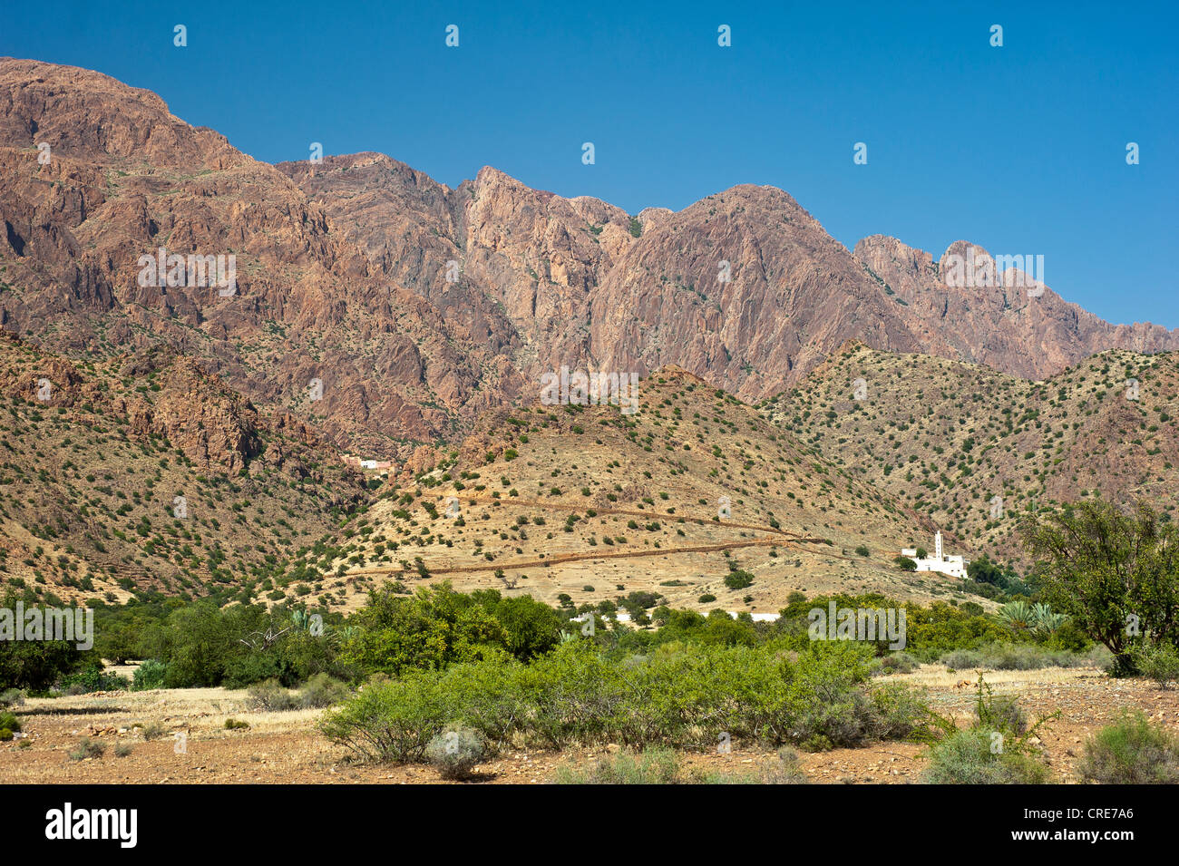 Typical mountain landscape in the Anti-Atlas Mountains, a mosque with minaret on a hill, Anti-Atlas mountain range Stock Photo