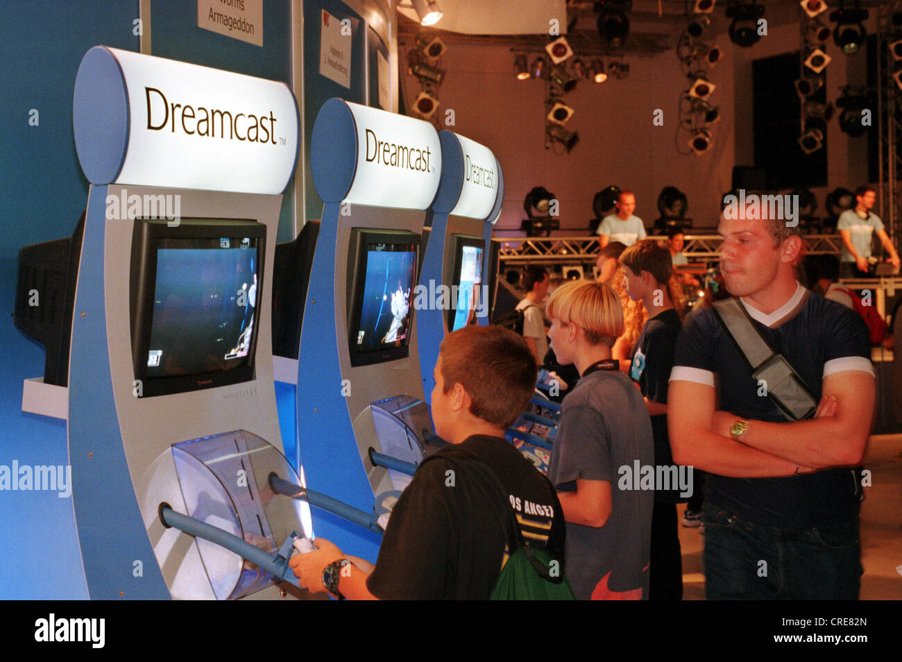 Teenagers playing on a Sega Dreamcast Playstation, IFA 1999, Berlin, Germany Stock Photo