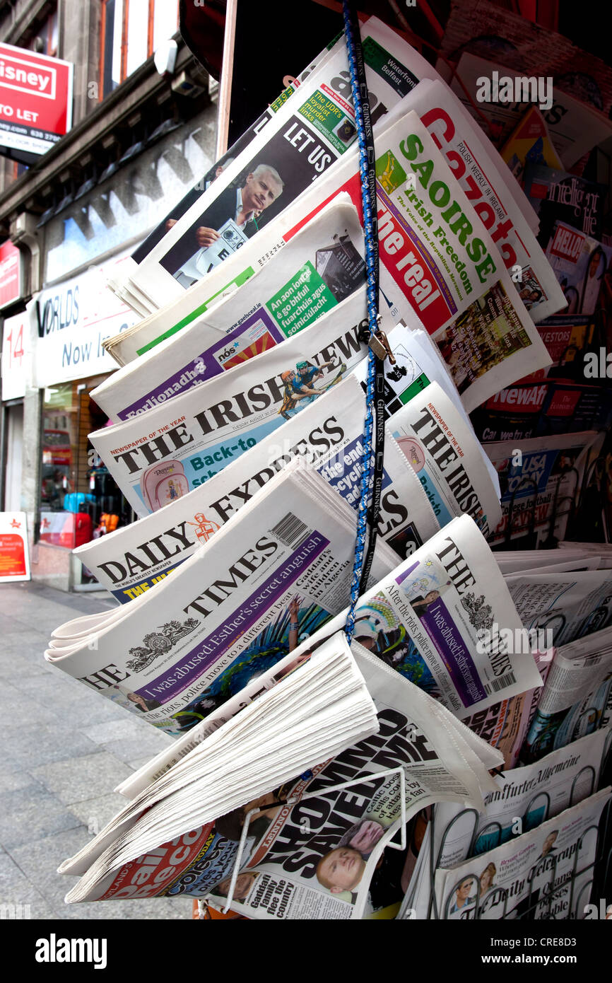 Stall with Irish and international newspapers in the shopping district of Henry Street in Dublin, Ireland, Europe Stock Photo