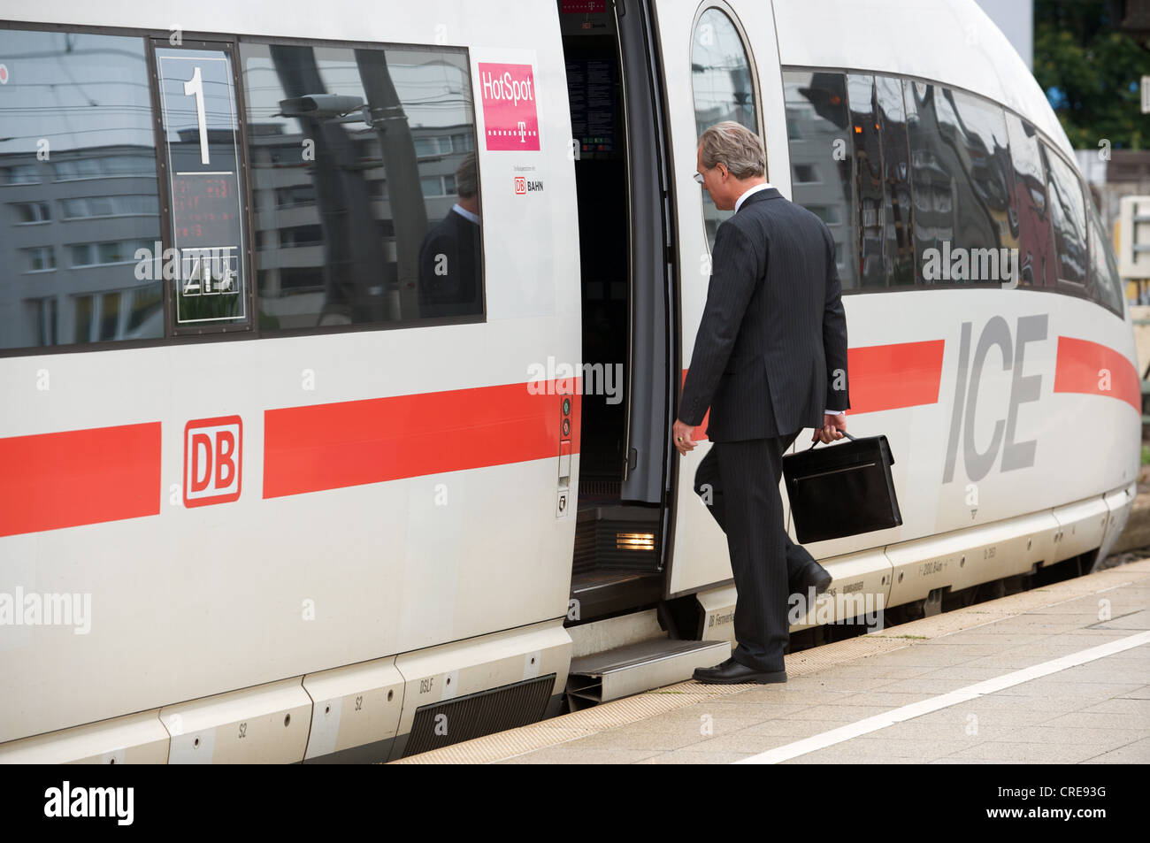 First Class business passenger boarding Inter-City Express (ICE) train Cologne Germany Stock Photo