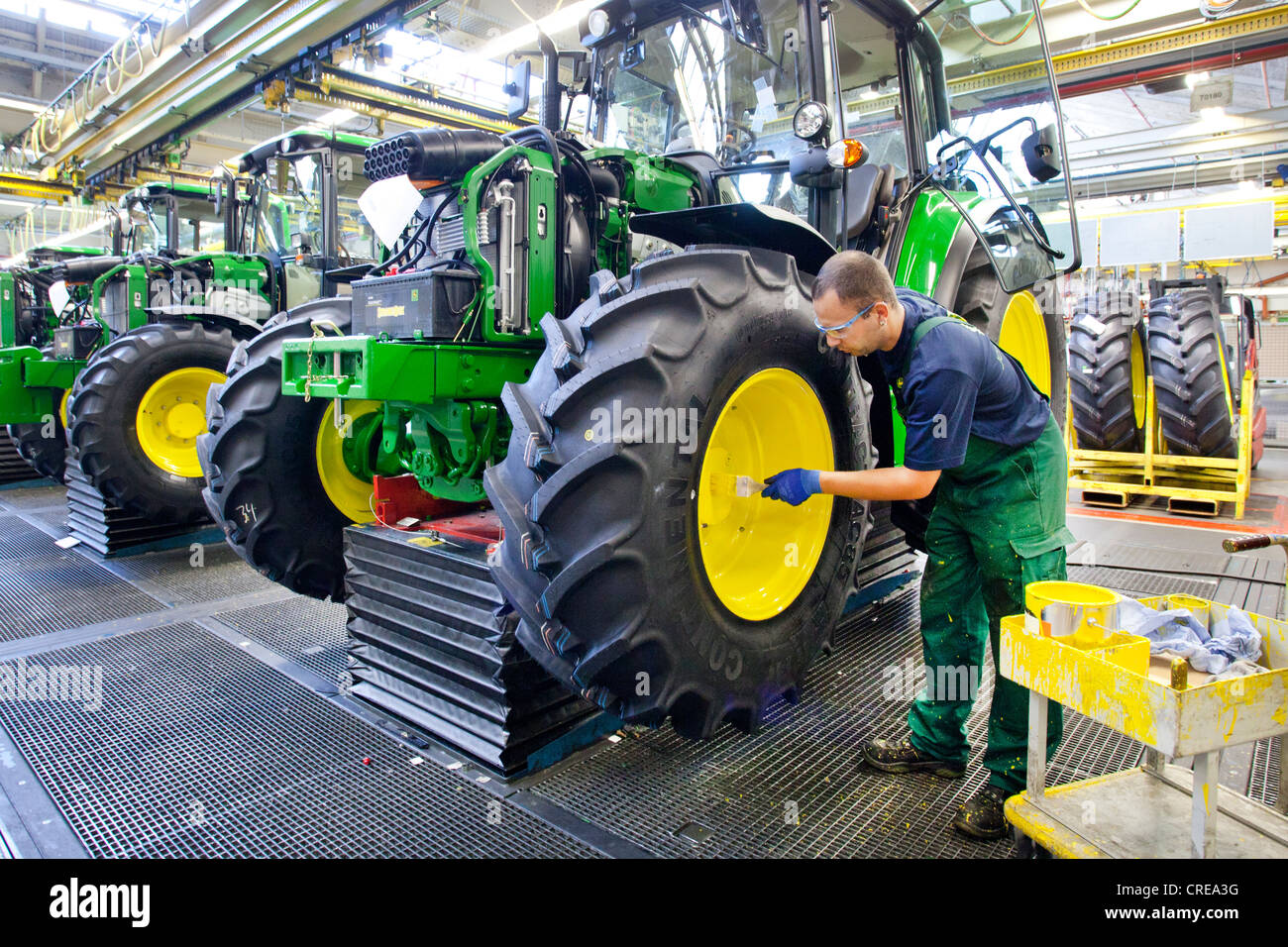 Wheels are given a coat of paint in the tractor production section at