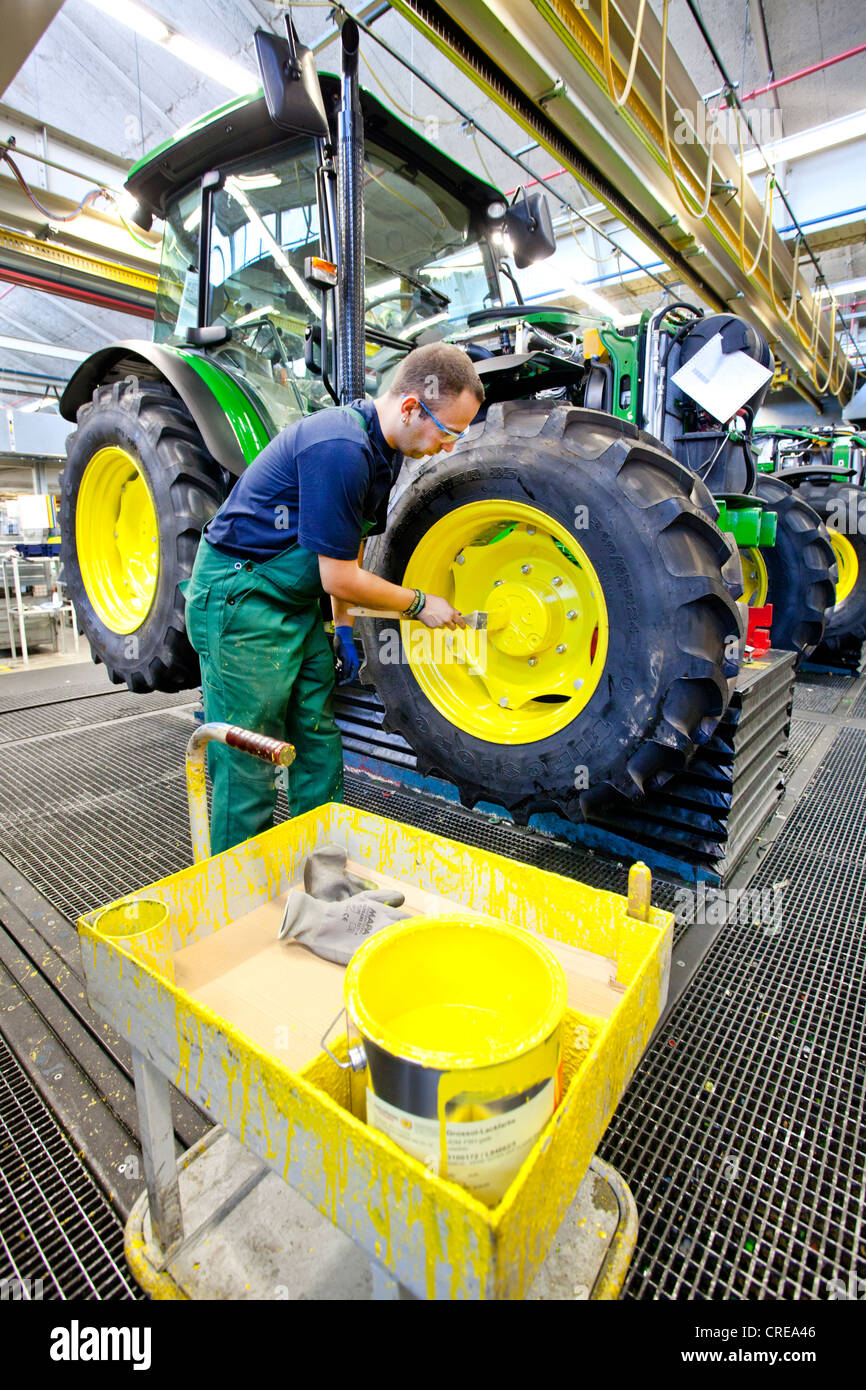 Wheels are given a coat of paint in the tractor production section at