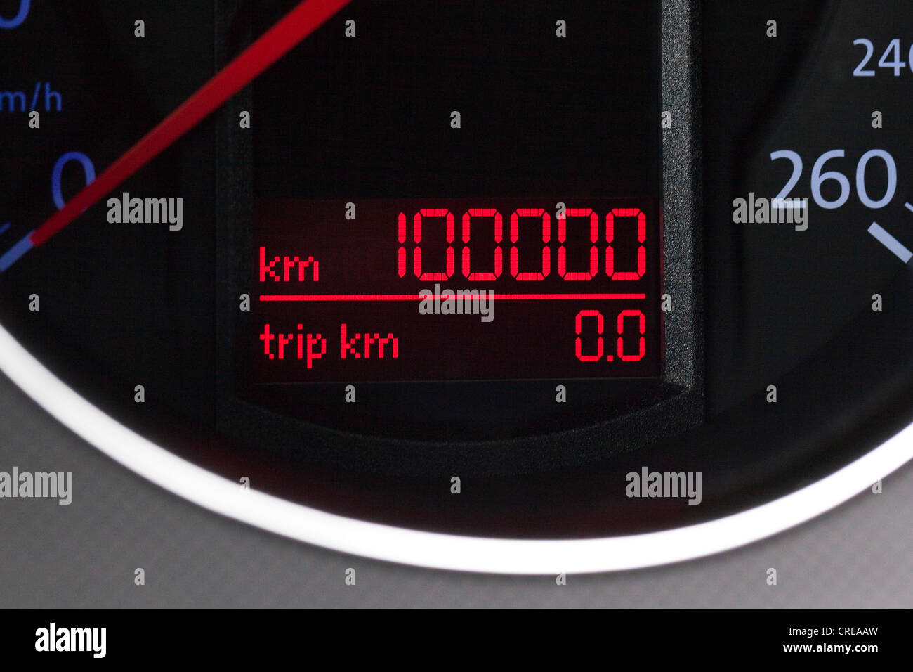 Speedometer, mileage of 100, 000 kilometers in the instrument panel in the cockpit of a Volkswagen, VW Stock Photo