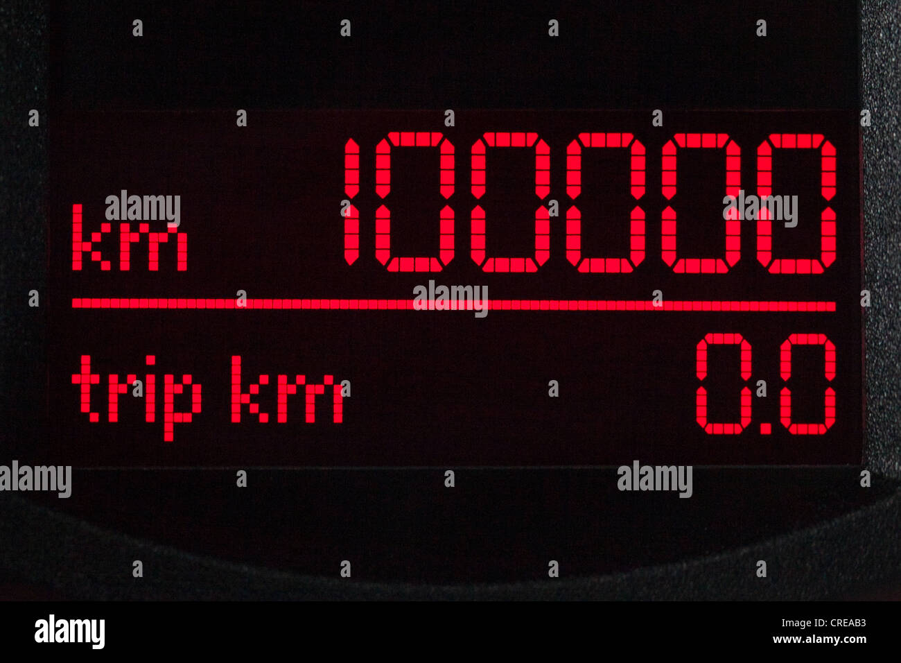 Speedometer, mileage of 100, 000 kilometers in the instrument panel in the cockpit of a Volkswagen, VW Stock Photo