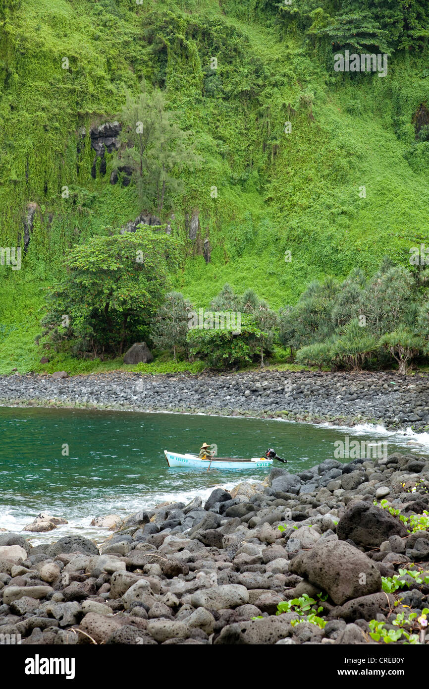 Fishing boat on the beach, Anse des Cascades destination in Piton Sainte-Rose, Reunion island, Indian Ocean Stock Photo