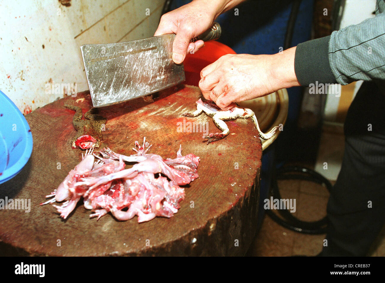 Chinese Skinning Of Frogs In Hong Kong Stock Photo Alamy