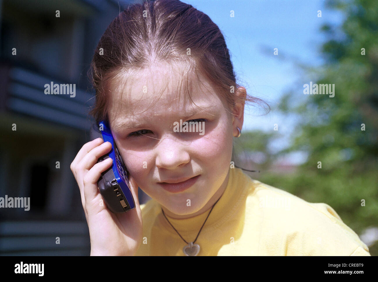 Child with mobile phone, Essen, Germany Stock Photo
